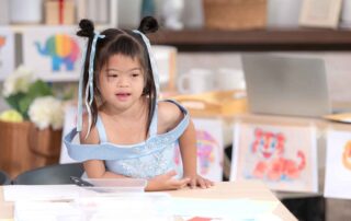 Young child with special needs participating in a learning activity supported by occupational therapy at OrbRom Center Phnom Penh