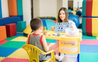 A child working on language and cognitive skills during an occupational therapy session at OrbRom Center in Phnom Penh.