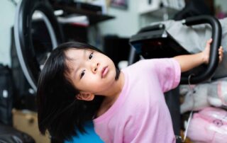 Young child engaging in movement play that supports sensory and motor development, relevant to occupational therapy in Phnom Penh