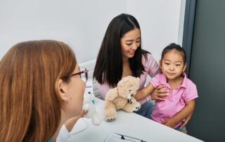 A young girl attends an occupational therapy consultation with her mother at a child development center in Phnom Penh.